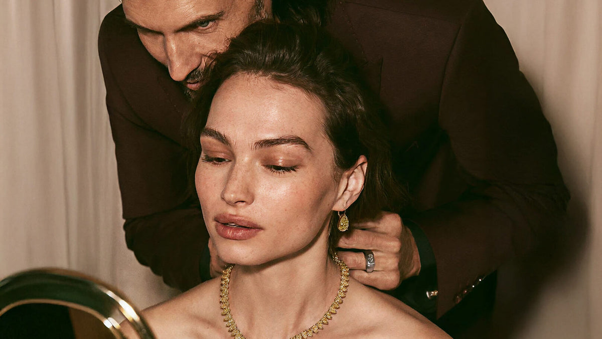 A man wearing a jewel to a women