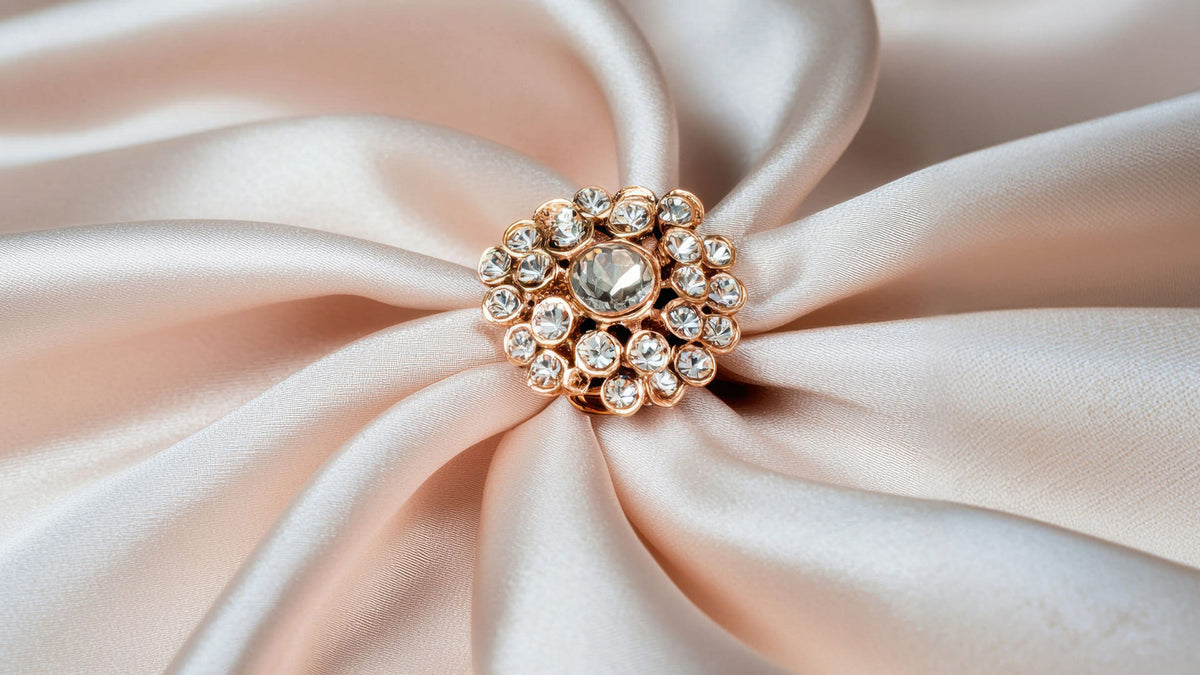 Decorative brooch with gemstones on a soft fabric cloth